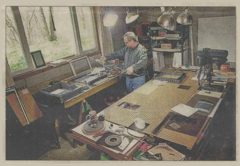 Brian Algar in basement shop making pet doors