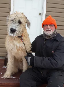 Huge Irish Wolfhound and his owner, customers of RANGER Pet Doors